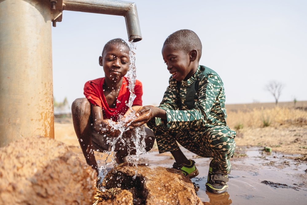 African,Young,Children,Drinking,Fresh,Clean,Water,From,A,Tap.